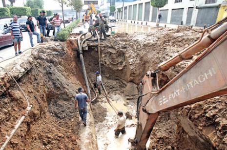Workers in Wet Trench